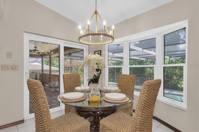 2174 Kent Ave, Clearwater, FL 33764 - dining area with a chandelier and light tile patterned floors