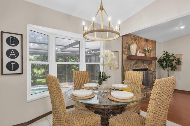 2174 Kent Ave, Clearwater, FL 33764 - dining space featuring a chandelier and lofted ceiling