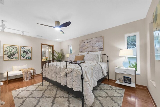2174 Kent Ave, Clearwater, FL 33764 - bedroom featuring wood finished floors and a ceiling fan