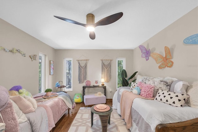 2174 Kent Ave, Clearwater, FL 33764 - bedroom with multiple windows, wood finished floors, and a ceiling fan