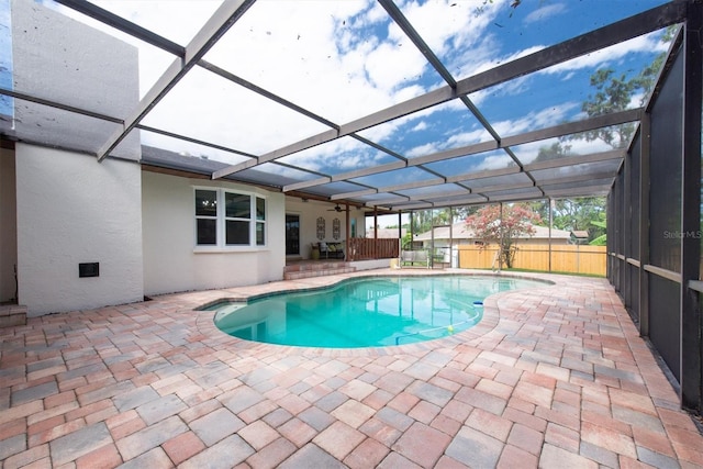 2174 Kent Ave, Clearwater, FL 33764 - view of swimming pool featuring a patio area, glass enclosure, and a ceiling fan