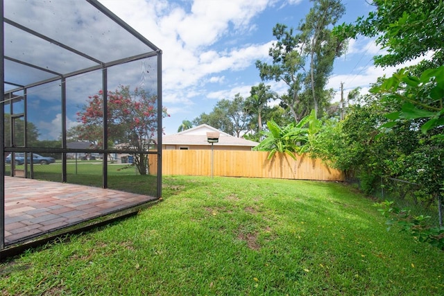 2174 Kent Ave, Clearwater, FL 33764 - fenced backyard with glass enclosure and a patio