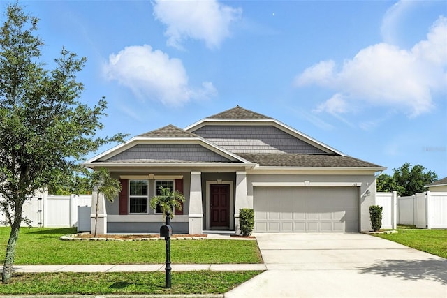 303 Briarbrook Ln, Haines City, FL 33844 - view of front facade featuring concrete driveway, a garage, stucco siding, a gate, and a porch