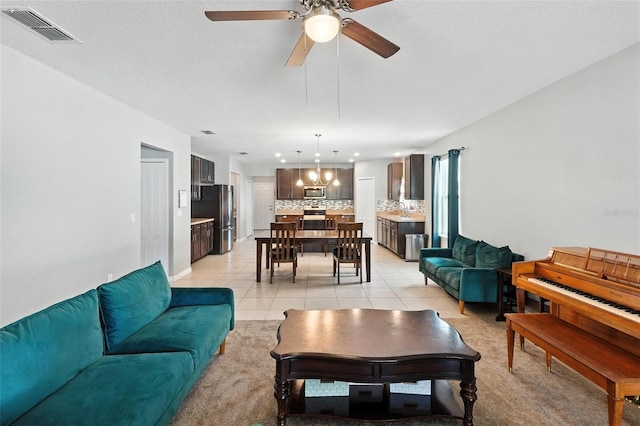 303 Briarbrook Ln, Haines City, FL 33844 - living room with a ceiling fan and light tile patterned floors