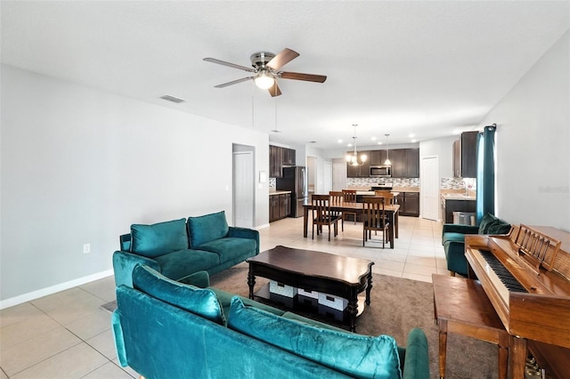 303 Briarbrook Ln, Haines City, FL 33844 - living room with light tile patterned floors, a ceiling fan, and recessed lighting