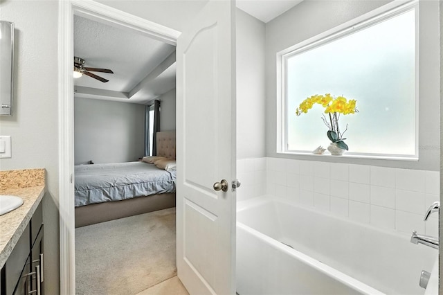 303 Briarbrook Ln, Haines City, FL 33844 - ensuite bathroom featuring vanity, a bath, and ceiling fan