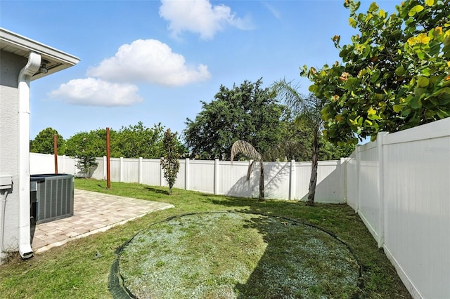 303 Briarbrook Ln, Haines City, FL 33844 - fenced backyard with a patio area