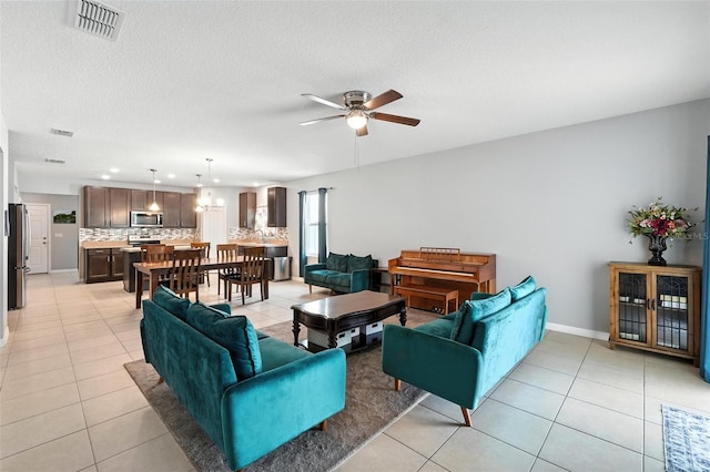 303 Briarbrook Ln, Haines City, FL 33844 - living area with light tile patterned floors, a ceiling fan, recessed lighting, and a textured ceiling