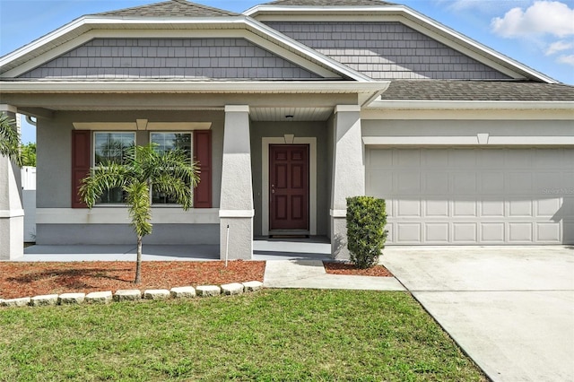 303 Briarbrook Ln, Haines City, FL 33844 - view of front of house featuring roof with shingles, a garage, concrete driveway, and stucco siding