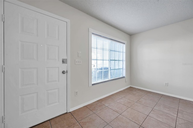 1302 Twilridge Pl, Brandon, FL 33511 - foyer entrance with a textured ceiling and light tile patterned floors