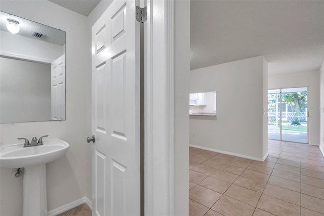 1302 Twilridge Pl, Brandon, FL 33511 - bathroom with tile patterned flooring and a textured ceiling