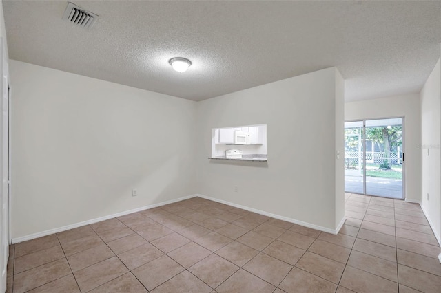 1302 Twilridge Pl, Brandon, FL 33511 - unfurnished room with light tile patterned floors and a textured ceiling