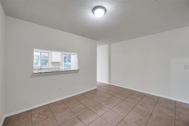 1302 Twilridge Pl, Brandon, FL 33511 - unfurnished room with a textured ceiling and light tile patterned floors