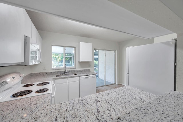 1302 Twilridge Pl, Brandon, FL 33511 - kitchen with white appliances, white cabinets, and light tile patterned flooring