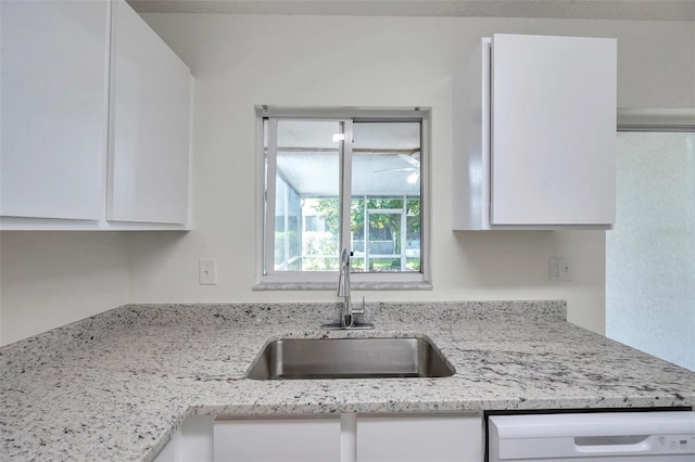 1302 Twilridge Pl, Brandon, FL 33511 - kitchen featuring white cabinetry, dishwasher, and light stone countertops
