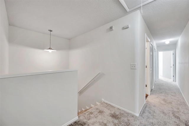 1302 Twilridge Pl, Brandon, FL 33511 - hall featuring an upstairs landing, attic access, carpet floors, and a textured ceiling