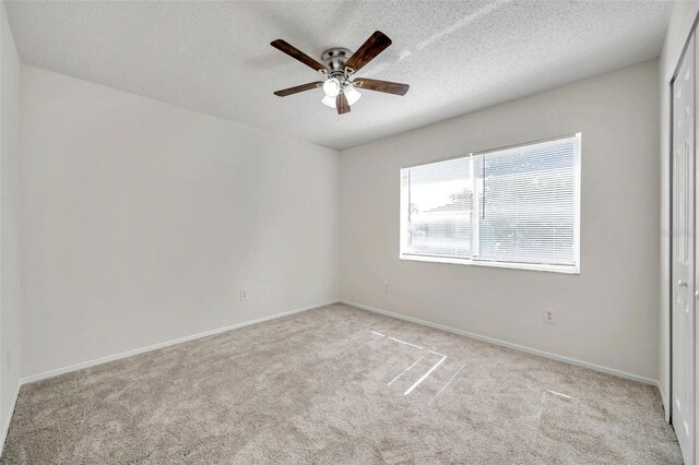 1302 Twilridge Pl, Brandon, FL 33511 - spare room featuring ceiling fan, carpet floors, and a textured ceiling