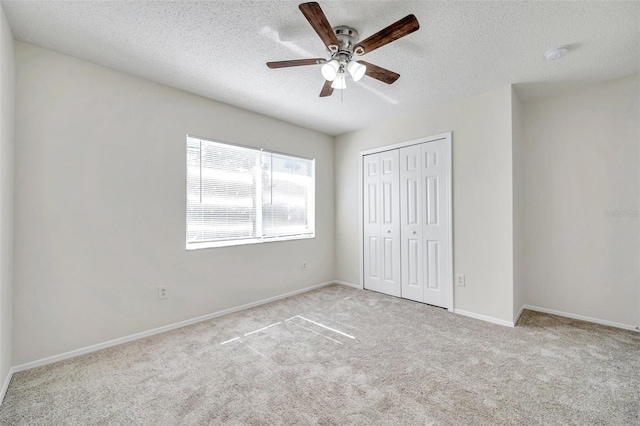 1302 Twilridge Pl, Brandon, FL 33511 - unfurnished bedroom featuring a textured ceiling, carpet flooring, a closet, and ceiling fan