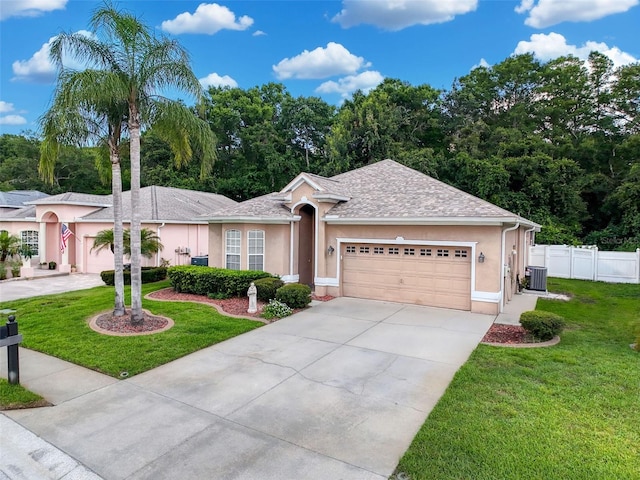 12200 Hunters Lake Dr, New Port Richey, FL 34654 - ranch-style house with stucco siding, an attached garage, driveway, and roof with shingles