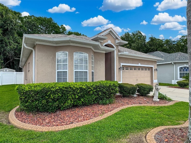 12200 Hunters Lake Dr, New Port Richey, FL 34654 - single story home with stucco siding, a garage, and concrete driveway
