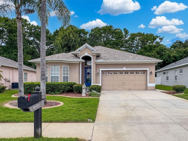 12200 Hunters Lake Dr, New Port Richey, FL 34654 - ranch-style house featuring stucco siding, a front lawn, a garage, and driveway