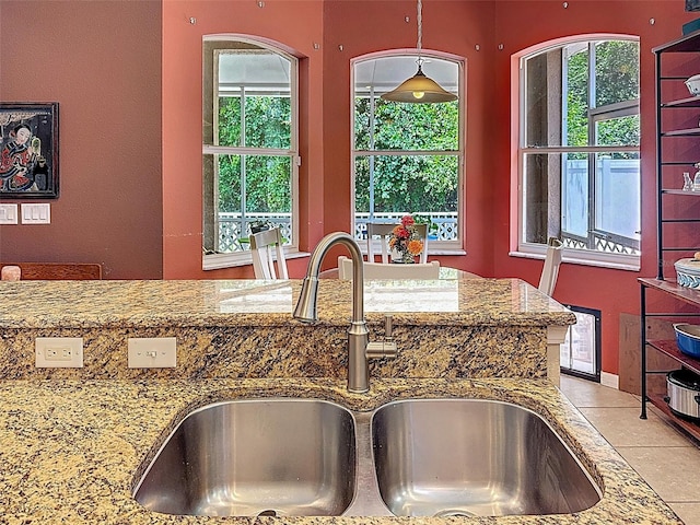 12200 Hunters Lake Dr, New Port Richey, FL 34654 - kitchen featuring stone countertops, plenty of natural light, and light tile patterned floors