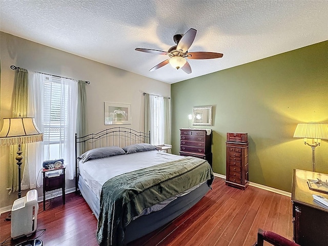 12200 Hunters Lake Dr, New Port Richey, FL 34654 - bedroom with wood finished floors, ceiling fan, and a textured ceiling