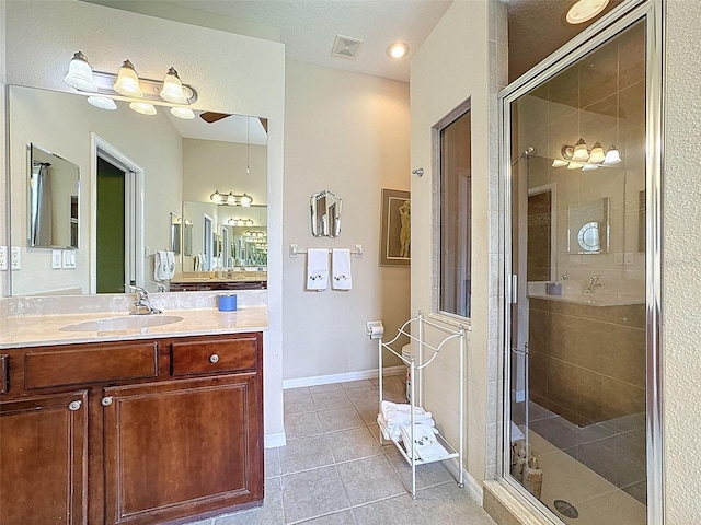 12200 Hunters Lake Dr, New Port Richey, FL 34654 - bathroom with a shower stall, tile patterned flooring, vanity, and ceiling fan