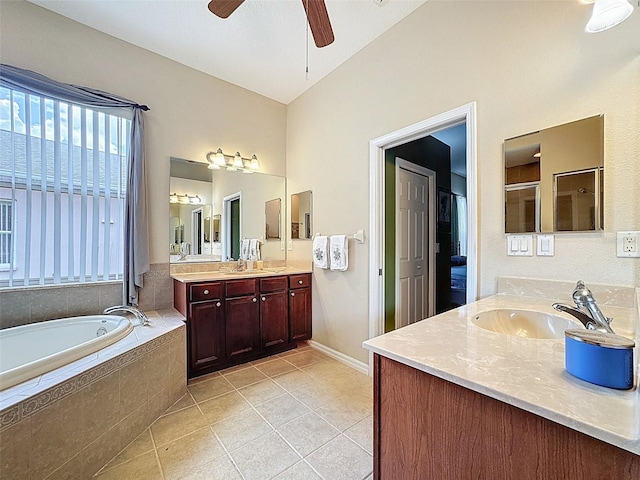 12200 Hunters Lake Dr, New Port Richey, FL 34654 - bathroom with tile patterned flooring, a garden tub, two vanities, ceiling fan, and a shower with shower door