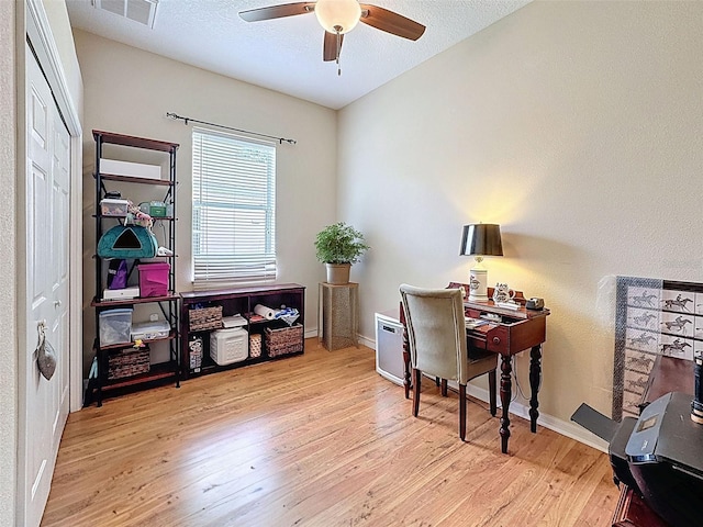 12200 Hunters Lake Dr, New Port Richey, FL 34654 - office space featuring ceiling fan, wood finished floors, and a textured ceiling