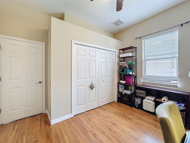 12200 Hunters Lake Dr, New Port Richey, FL 34654 - office area with light wood-type flooring, a textured ceiling, and a ceiling fan