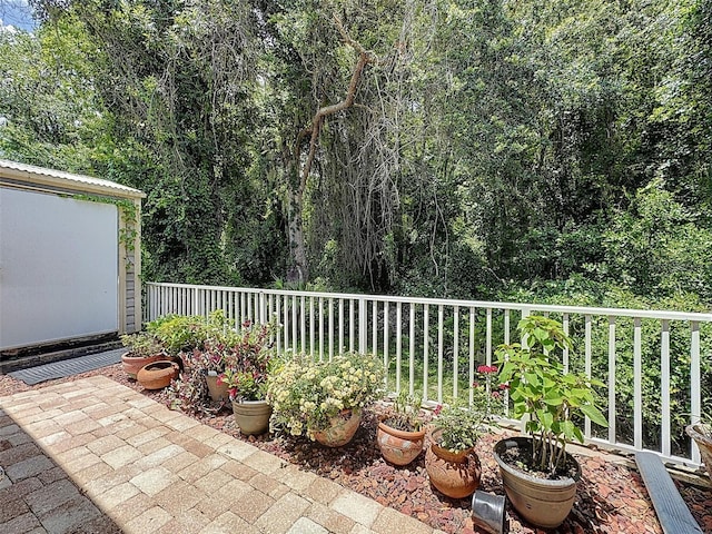 12200 Hunters Lake Dr, New Port Richey, FL 34654 - view of patio with a forest view