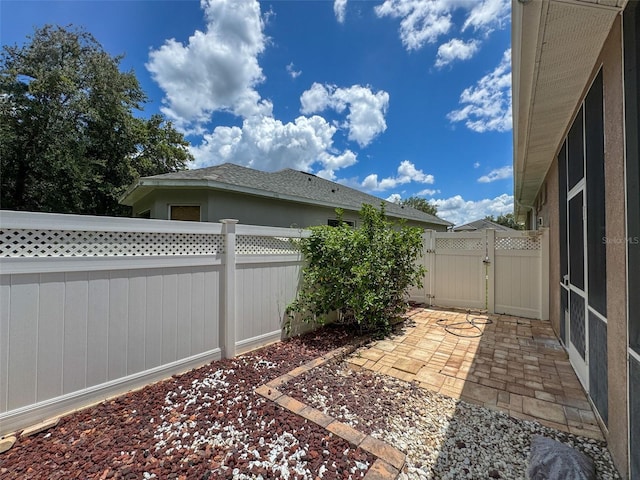 12200 Hunters Lake Dr, New Port Richey, FL 34654 - fenced backyard with a gate and a patio area