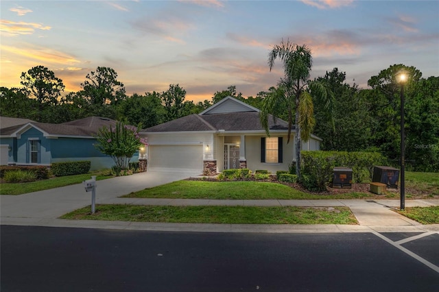 11144 Paradise Point Way, New Port Richey, FL 34654 - single story home with an attached garage, driveway, a lawn, and stucco siding