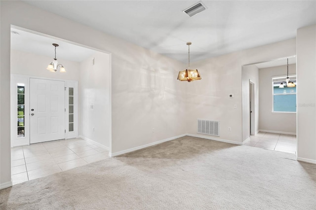 11144 Paradise Point Way, New Port Richey, FL 34654 - carpeted entryway with a chandelier and tile patterned floors