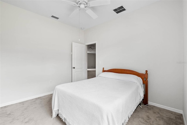 11144 Paradise Point Way, New Port Richey, FL 34654 - carpeted bedroom with baseboards and ceiling fan