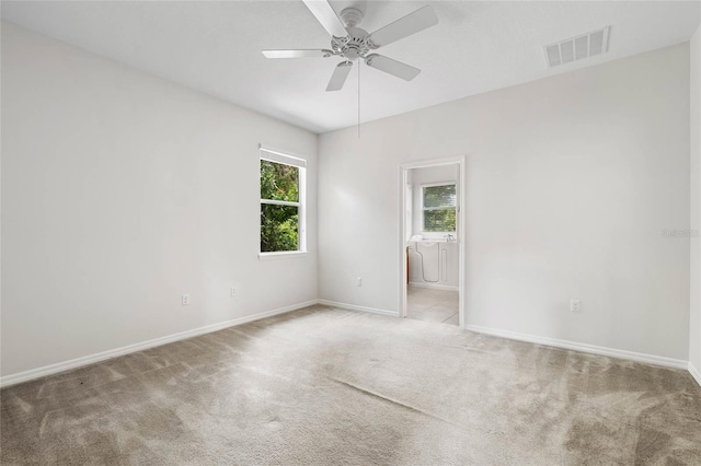 11144 Paradise Point Way, New Port Richey, FL 34654 - carpeted spare room featuring baseboards and ceiling fan
