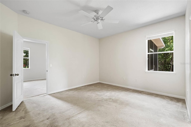 11144 Paradise Point Way, New Port Richey, FL 34654 - spare room with carpet floors, a smoke detector, plenty of natural light, and ceiling fan