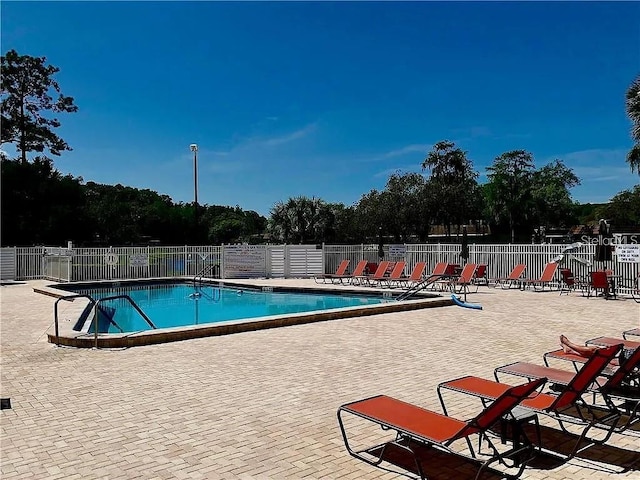 11144 Paradise Point Way, New Port Richey, FL 34654 - community pool with a patio area