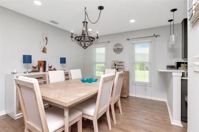 717 Manchester Woods Dr Unit 717, Sun City Center, FL 33573 - dining room featuring a chandelier, light wood finished floors, and recessed lighting