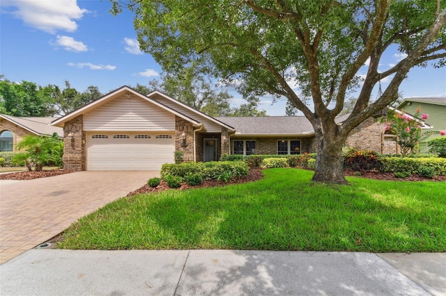 1810 Tamerlane Pl, Brandon, FL 33510 - ranch-style home featuring a garage, brick siding, driveway, and a front lawn
