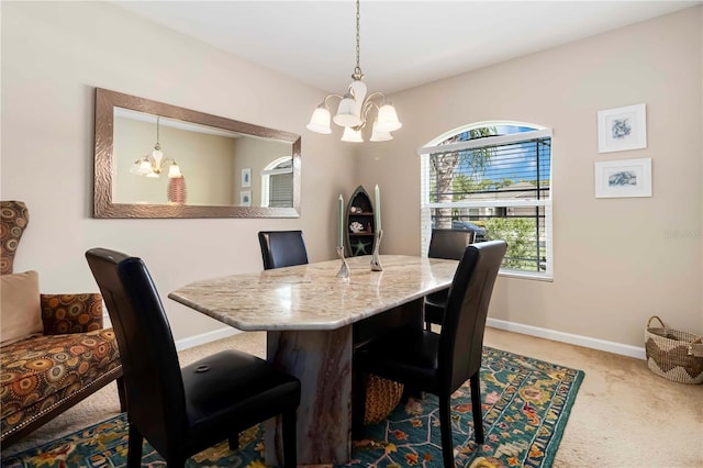 5264 Brilliance Cir, Cocoa, FL 32926 - dining area featuring a chandelier and carpet