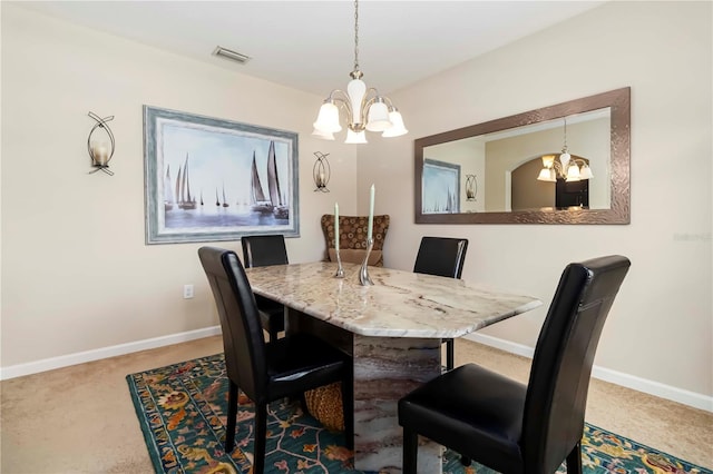 5264 Brilliance Cir, Cocoa, FL 32926 - dining area with a chandelier and carpet floors