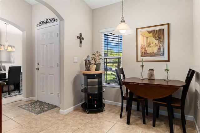 5264 Brilliance Cir, Cocoa, FL 32926 - dining room with arched walkways and light tile patterned flooring
