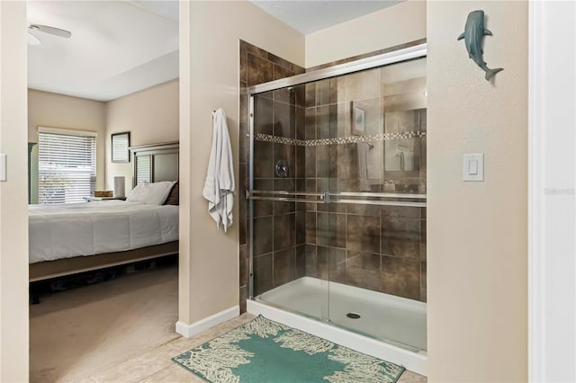 5264 Brilliance Cir, Cocoa, FL 32926 - bathroom with connected bathroom, a stall shower, tile patterned floors, and a ceiling fan