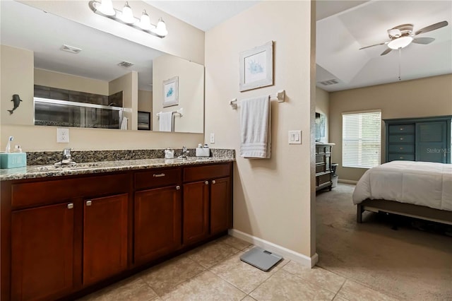 5264 Brilliance Cir, Cocoa, FL 32926 - bathroom with double vanity, a ceiling fan, a shower stall, tile patterned floors, and connected bathroom