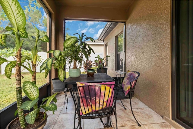 5264 Brilliance Cir, Cocoa, FL 32926 - sunroom featuring a textured wall and tile patterned flooring