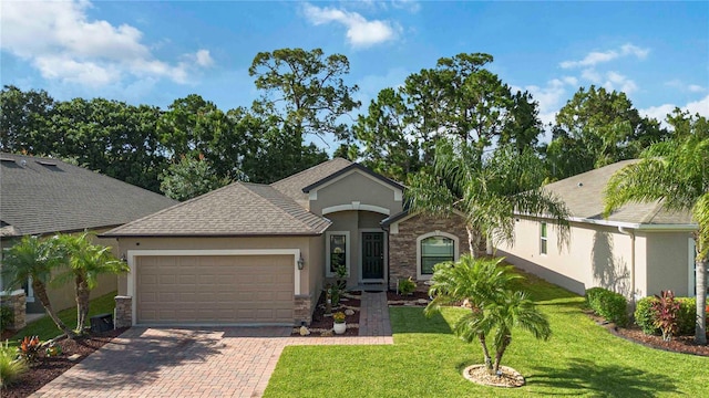 5264 Brilliance Cir, Cocoa, FL 32926 - single story home with stucco siding, a garage, stone siding, decorative driveway, and a front lawn