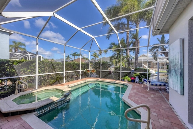4743 Spinnaker Dr, Bradenton, FL 34208 - view of pool featuring a patio, a pool with connected hot tub, and glass enclosure