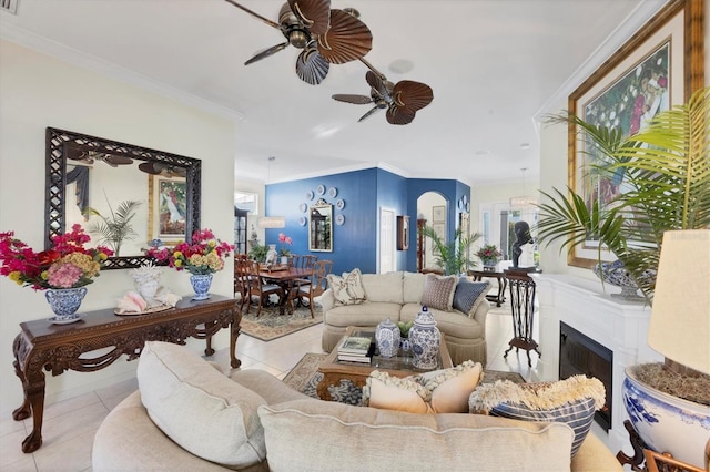 4743 Spinnaker Dr, Bradenton, FL 34208 - living room featuring a ceiling fan, ornamental molding, tile patterned floors, and a fireplace